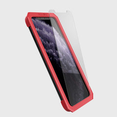 Showing defense glass flat on phone 11 pro max using installation tool