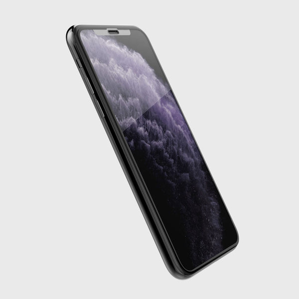 Defense Glass edge to edge is hovering over a black iphone 11 pro max