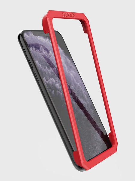 Showing the installation tool that is included and how it lays on the iPhone 11 pro max