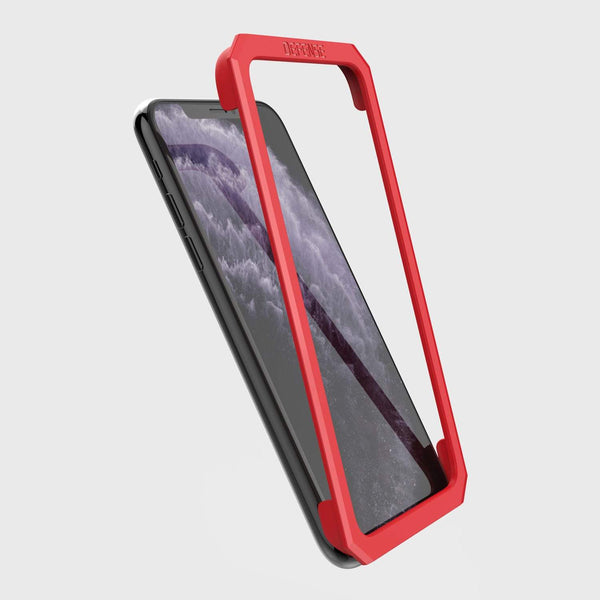 Showing the installation tool that is included and how it lays on the iPhone 11 pro max