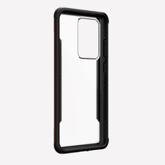 Displayed on a plain white background is the X-Doria Samsung Galaxy S20 Ultra Case Raptic Shield in red, featuring a cutout for the camera. It offers military-grade drop protection and wireless charging compatibility.