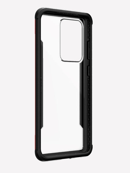 Displayed on a plain white background is the X-Doria Samsung Galaxy S20 Ultra Case Raptic Shield in red, featuring a cutout for the camera. It offers military-grade drop protection and wireless charging compatibility.
