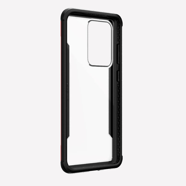 Displayed on a plain white background is the X-Doria Samsung Galaxy S20 Ultra Case Raptic Shield in red, featuring a cutout for the camera. It offers military-grade drop protection and wireless charging compatibility.