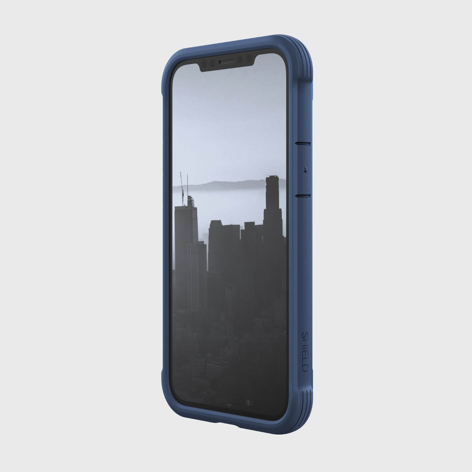 A blue Raptic iPhone 12 Mini Case - SHIELD with a city view.