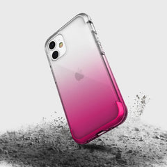 A Raptic Air iPhone 12 Mini case in pink and white with drop protection.