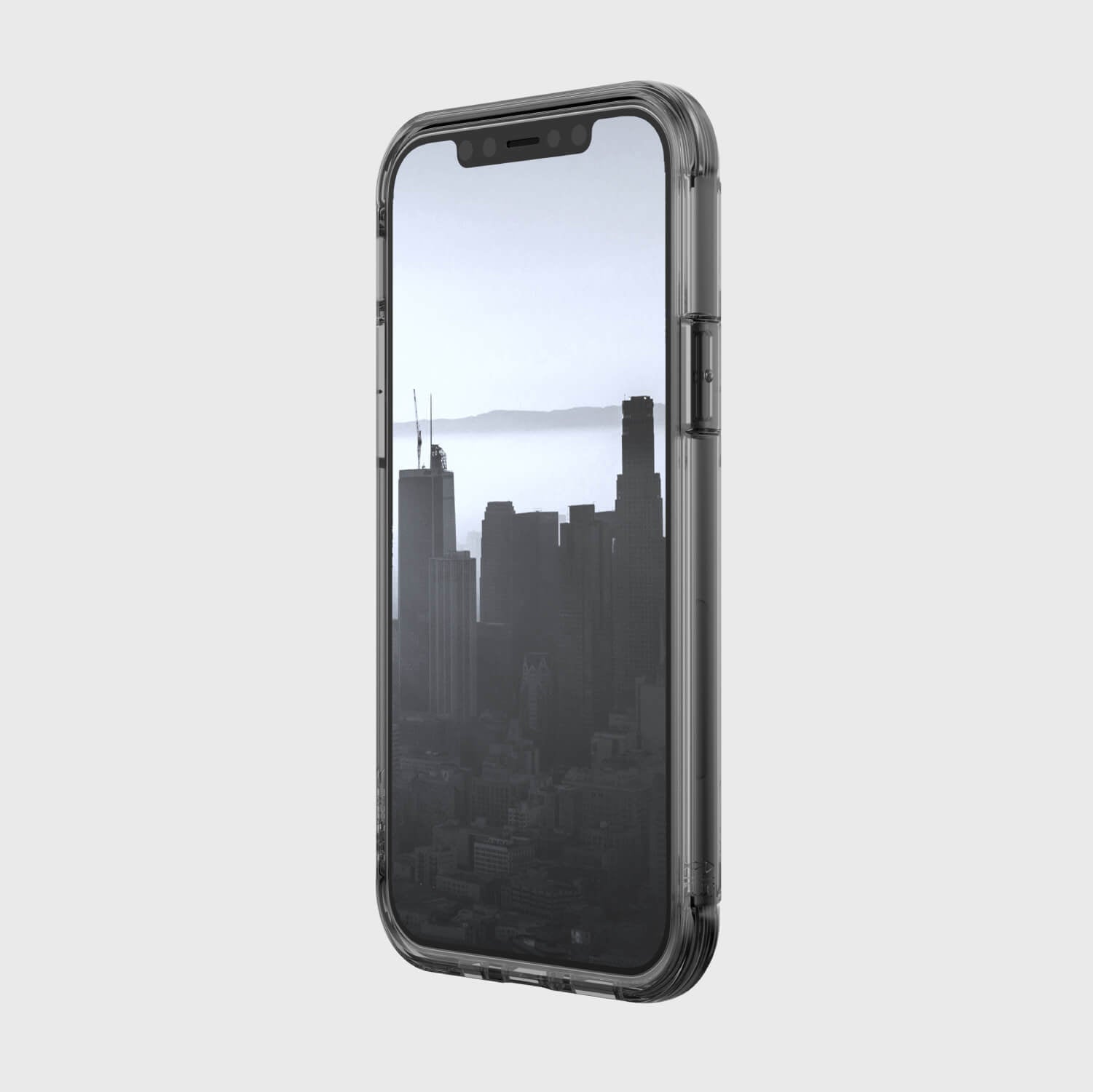 A black Raptic iPhone 12 & iPhone 12 Pro Case - AIR with a view of the city providing 13-foot drop protection and compatible with iPhone XR.