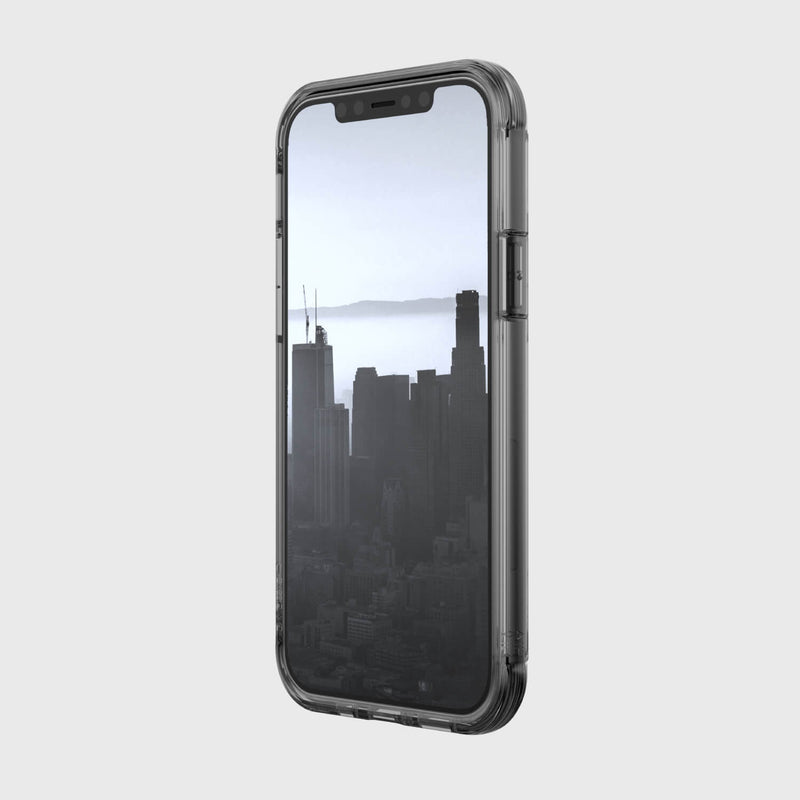 A Raptic Wireless Charging Compatible iPhone 12 Pro Max Case - AIR with a view of the city.