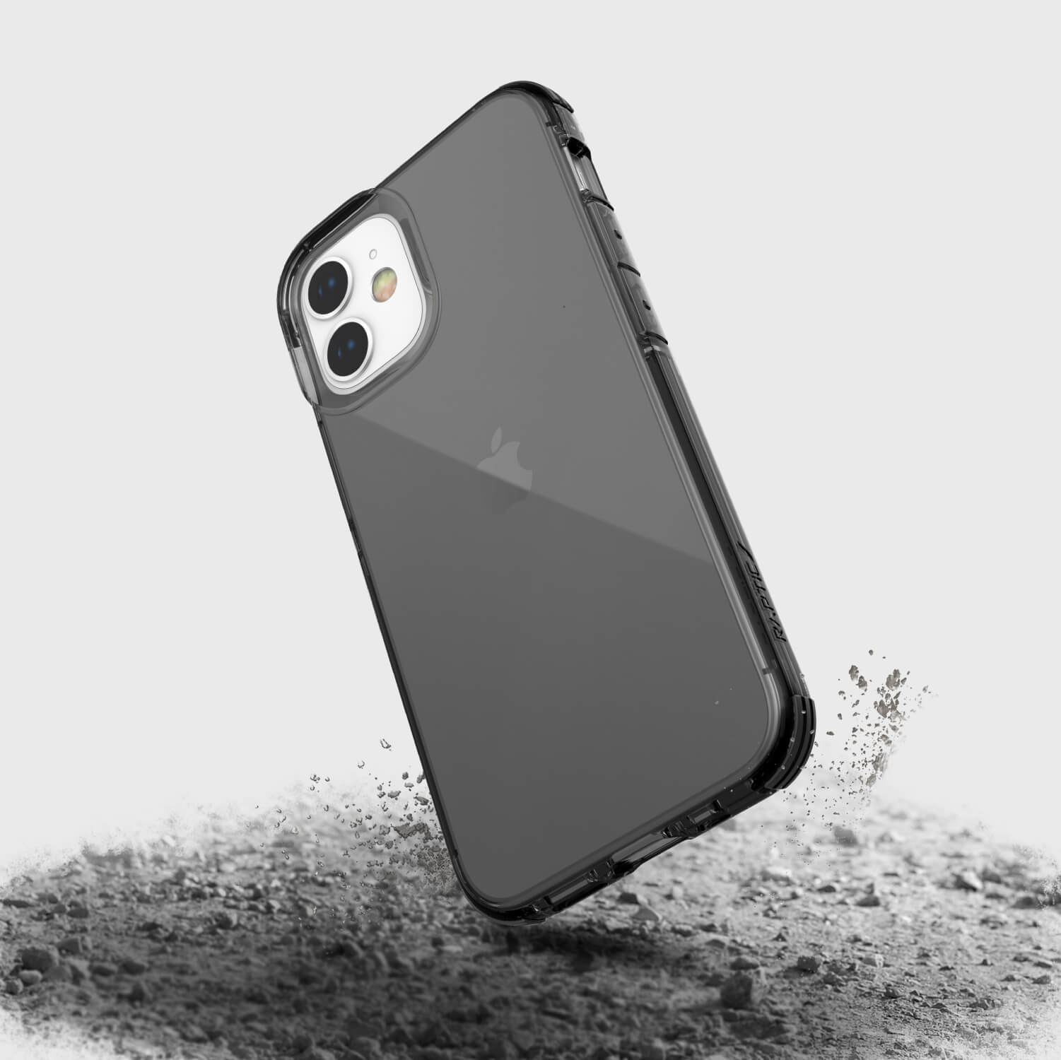 The back of a Raptic Clear iPhone 12 Mini Case with sand on it.