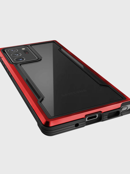 A red and black X-Doria Galaxy Note 20 Ultra Raptic Shield case with drop protection and wireless charging capabilities.