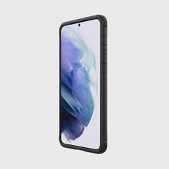 The X-Doria Samsung Galaxy S21 Case Raptic Shield Black is shown on a white background. It is wireless charging compatible and comes with a lifetime warranty.