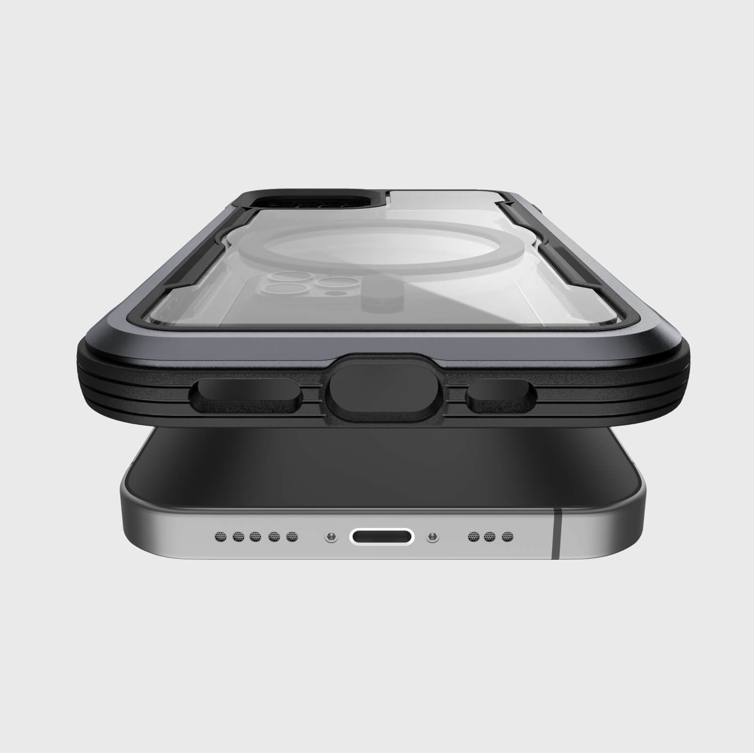 A Raptic SHIELD PRO MAGNET case equipped with MagSafe chargers is placed on top of an iPhone 12 Pro Max for efficient 15W charging rate.