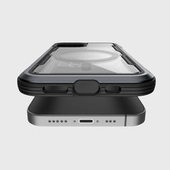 Two smartphones are stacked to show side and edge views. The top device is an iPhone 12, protected by a Raptic SHIELD PRO MAGNET transparent, rugged case for superior drop protection.
