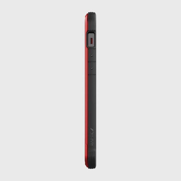 Side view of an iPhone 12 in a red and black SHIELD PRO MAGNET case by Raptic, highlighting buttons and speaker. This rugged iPhone 12 & iPhone 12 Pro case is designed for superior drop protection and integrates seamlessly with MagSafe chargers.