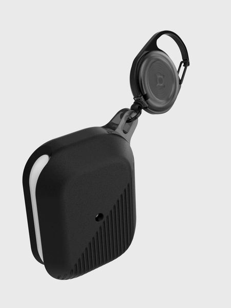A small black silicone Raptic device with a carabiner clip attached to it for protection; specifically, the Apple AirPods Pro Case - RADIUS.