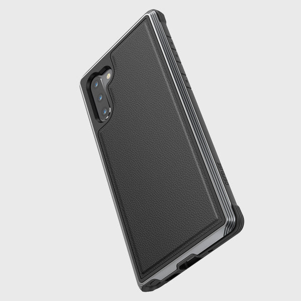 The Samsung Galaxy Note 10+ Case from Raptic in Lux Black Leather, features a textured back, dual camera cutout, military-grade drop protection, and wireless charging compatibility, stylishly displayed against a white background.