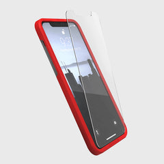 A red Raptic iPhone 13 Screen Protector - Full Coverage case with a tempered glass screen protector for scratch protection.