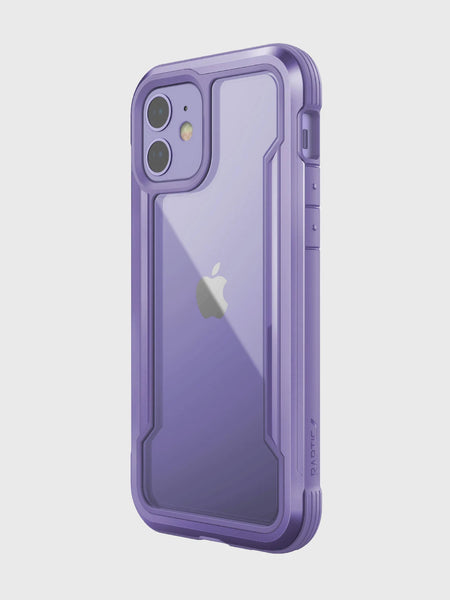 The Raptic iPhone 12 Raptic Shield case in purple features a transparent back that showcases the Apple logo. With a machined aluminum bumper for military-grade drop protection, it remains wireless charging compatible for ultimate convenience.