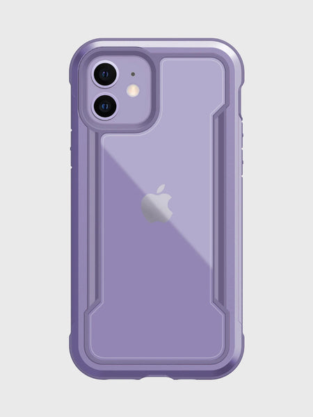 The Raptic iPhone 12 Raptic Shield case in purple features a logo-revealing clear back and offers military-grade drop protection for the camera and edges. Designed on a white background, it's compatible with wireless charging, blending convenience with style.