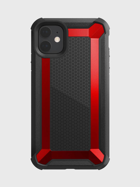 An iPhone 11 enclosed in a Raptic TACTICAL case has a red and black rugged design, featuring a hexagonal back pattern and shock-absorbing rubber exterior that meets Military Standard MIL-STD-810G.