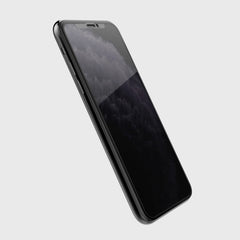A black iPhone XR with the Raptic iPhone 13 Pro Screen Protector - PRIVACY on its screen, placed on a white background.
