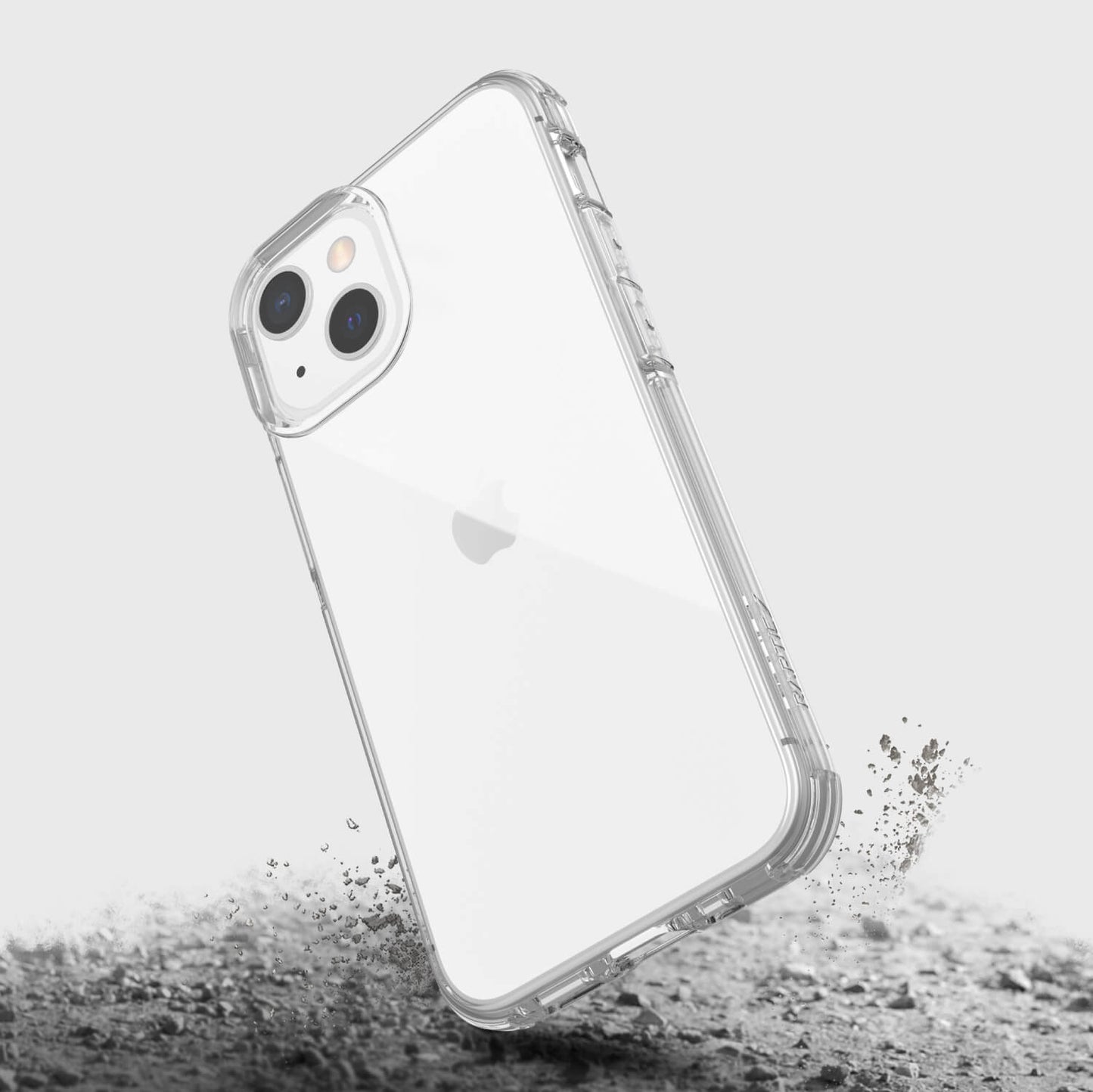A Raptic iPhone 13 Mini Case - CLEAR with sand on it.