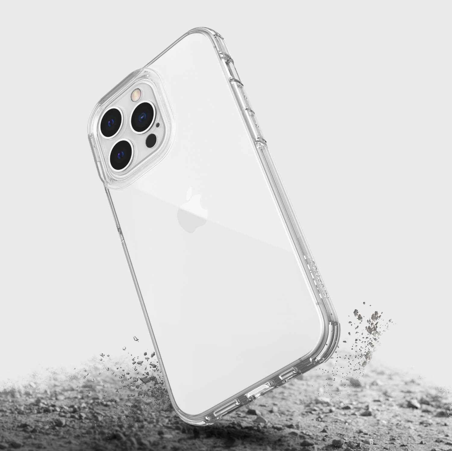 A clear iPhone 14 Pro case with sand on it from Raptic.