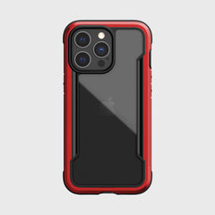 The back of a Raptic SHIELD PRO iPhone 13 Pro case in red and black, providing drop protection.