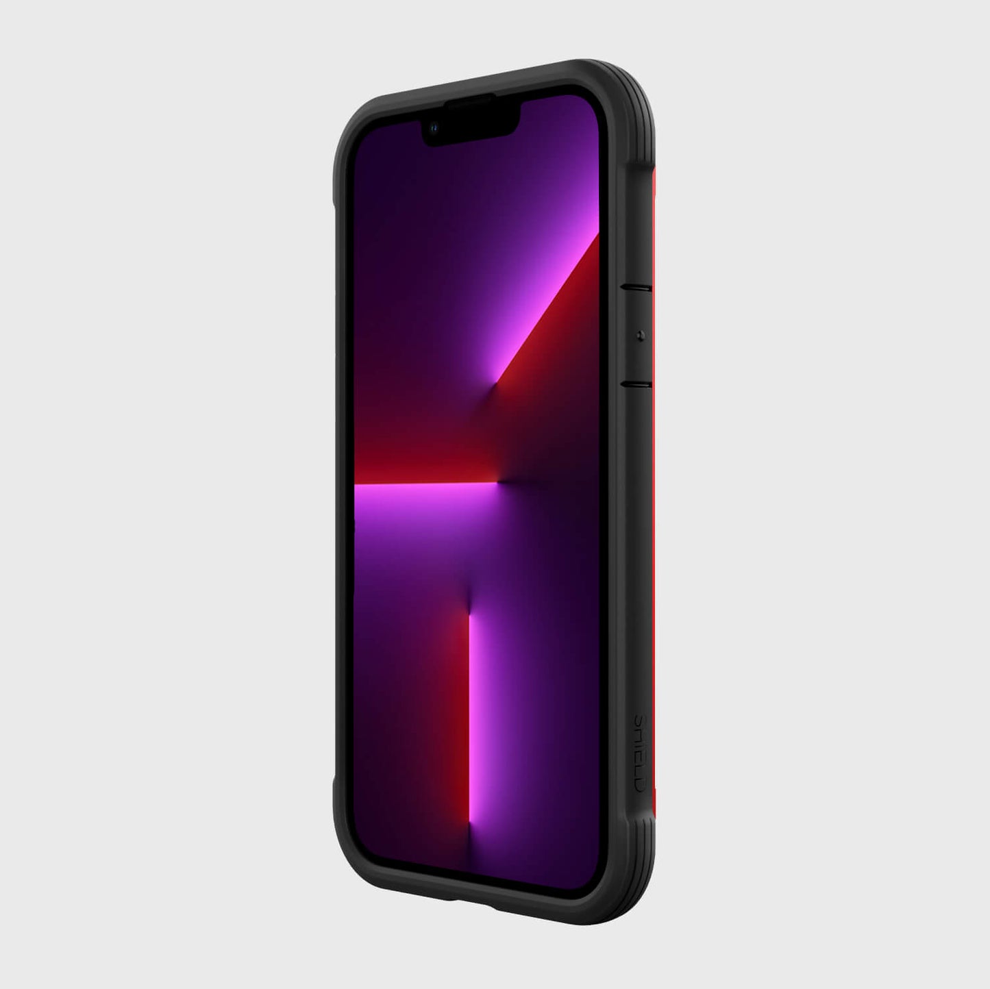 Showing the front of an iPhone 13 Pro Max inside a red Raptic Shield Case