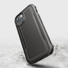 A black Raptic iPhone 14 case with a splash of water on it, providing military-grade drop protection.