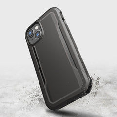 A black Raptic iPhone 14 case with a splash of water on it, providing military-grade drop protection.