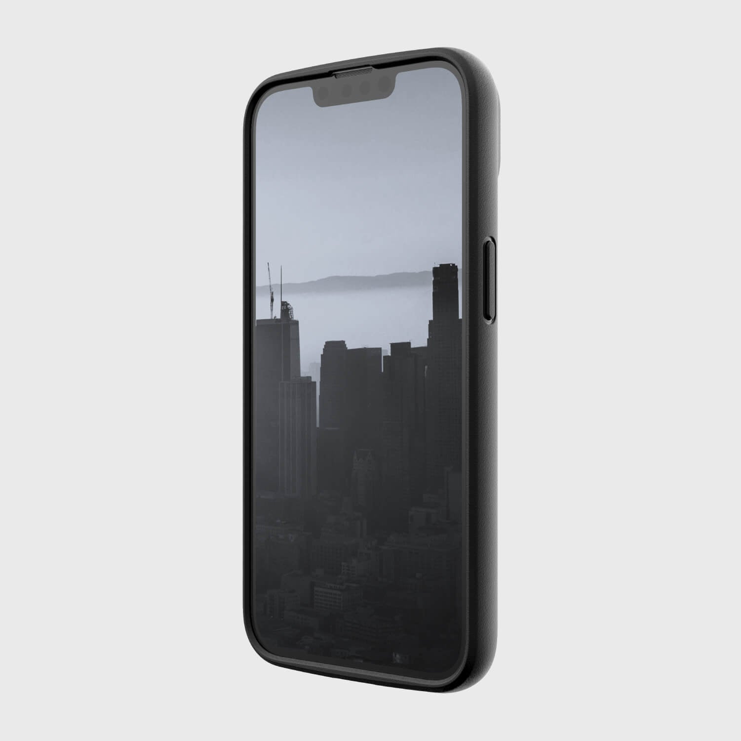 A slim black iPhone 14 Slim Case - Raptic Slim with a view of a city.