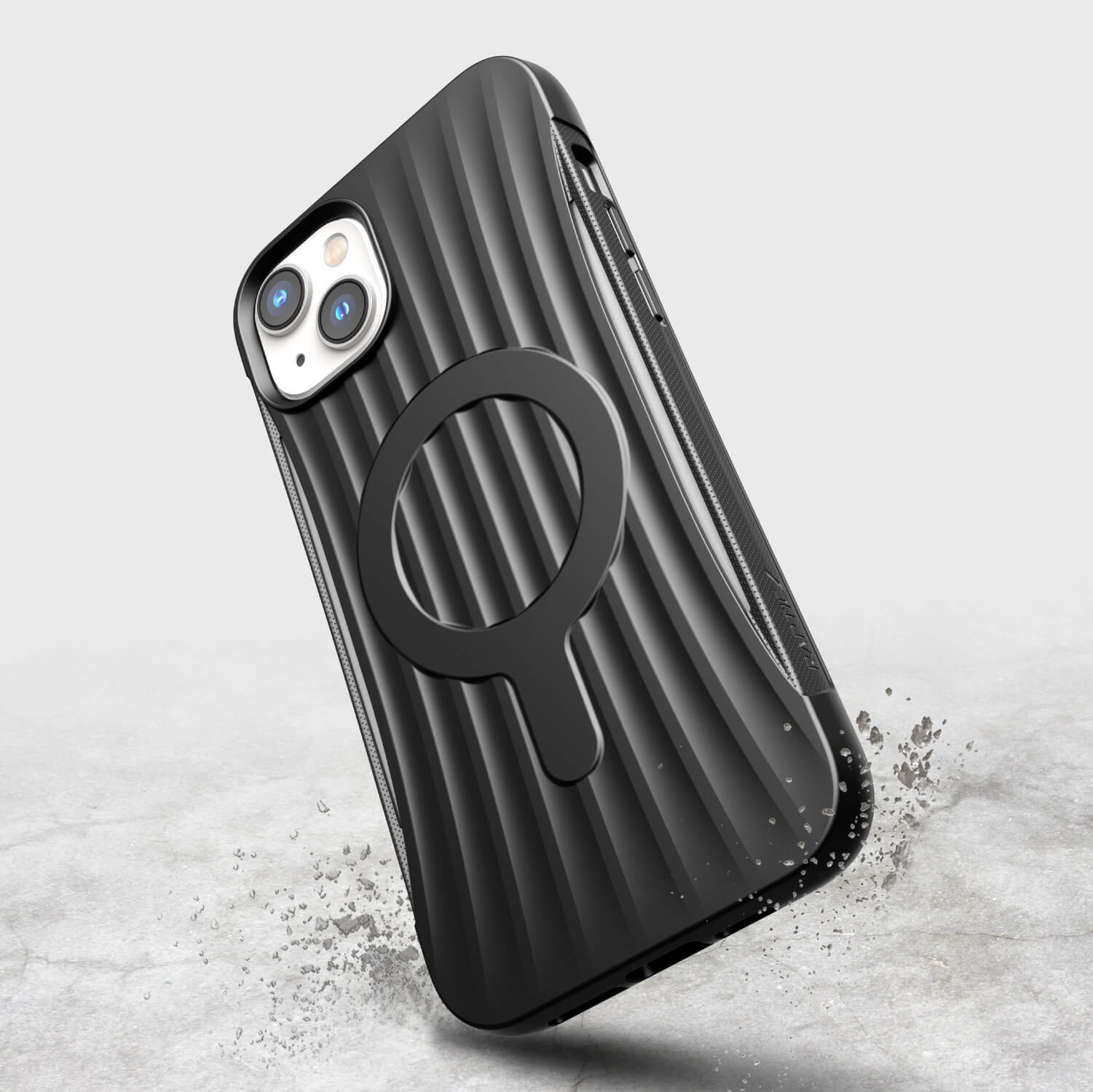 A black iPhone 14 Plus case with a circle on it ~ Raptic Clutch MagSafe.