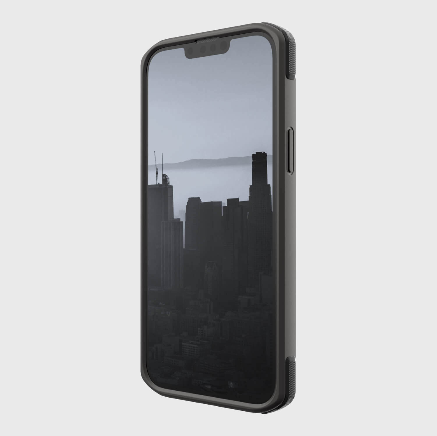 A black Raptic iPhone 14 Plus Case with Military Grade Drop Protection and a view of the city.