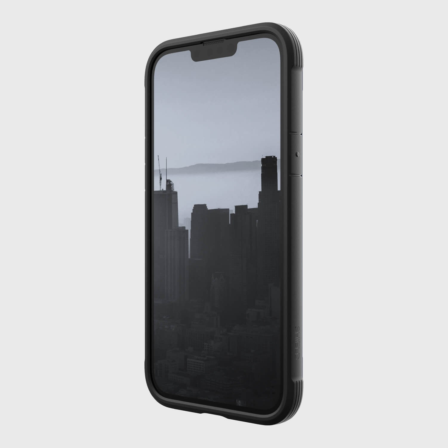 A Raptic wireless charging-compatible iPhone 14 Plus Case - Shield with a view of the city.