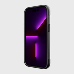 The back of an iPhone 14 Pro Case ~ Clutch with a purple light on it.