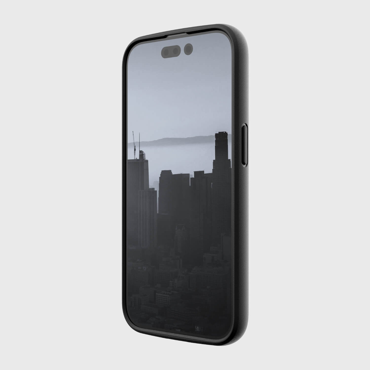 A black Raptic iPhone 14 Pro Case - Slim & Sleek with a view of a city, featuring texturing depth.