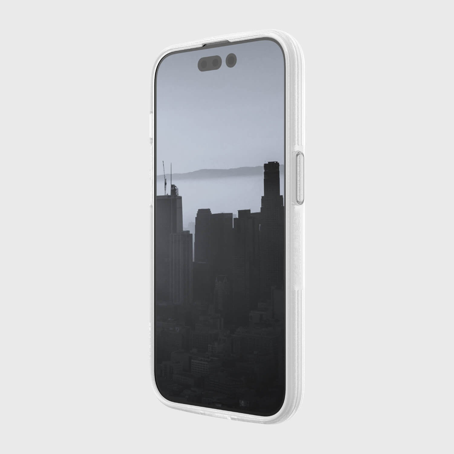 A white Raptic iPhone 14 Pro Case featuring a city skyline image with texturing depth.