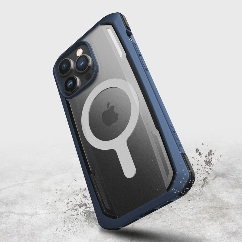The Raptic iPhone 14 Pro Max Case ~ Secure, in rugged blue, offers military-grade drop protection and a transparent back with a circular design that showcases the Apple logo as it hovers above a textured surface.