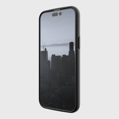 An environmentally friendly Raptic black phone with a slim Raptic case and a view of a city.
