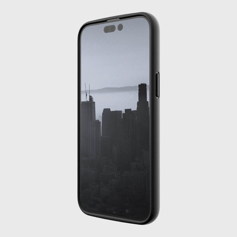 An environmentally friendly Raptic black phone with a slim Raptic case and a view of a city.