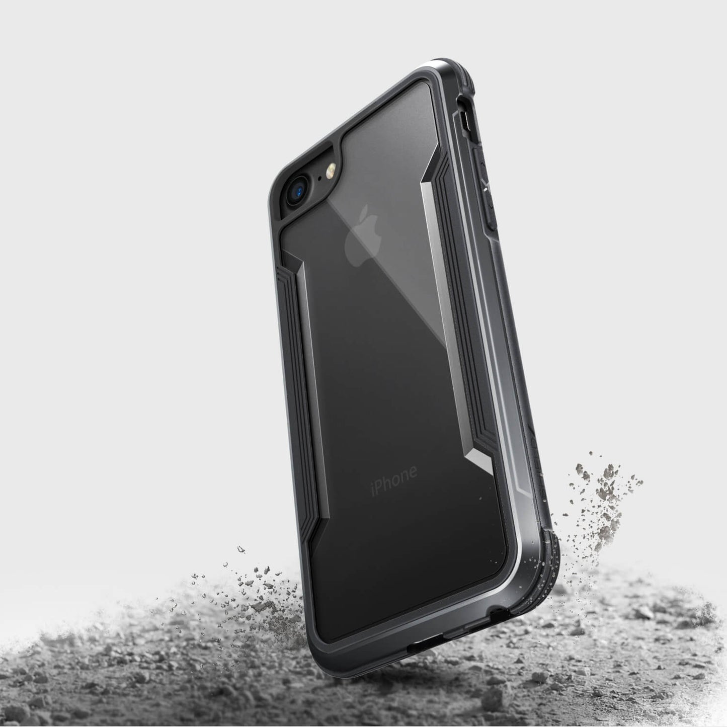 A black Raptic iPhone SE/8/7 Case - SHIELD with a splatter of sand on it.