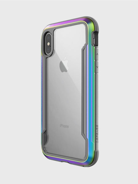 The iPhone X/XS Case - SHIELD by Raptic is an elegant clear cover with metallic iridescent trim, showcasing the Apple logo and camera while offering stylish military-grade drop protection.