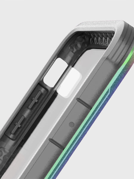 Close-up of a Raptic SHIELD case corner, featuring a transparent back, black edges, and iridescent trim. Designed for the iPhone X/XS with precise button cutouts, it offers military-grade drop protection.