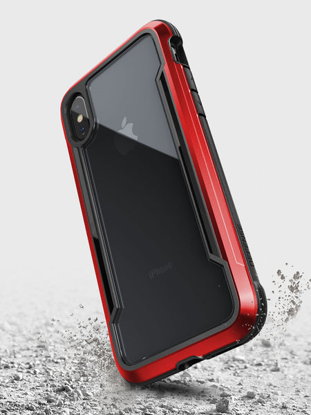 A Raptic SHIELD case for iPhone XS Max providing drop protection, found on the ground.