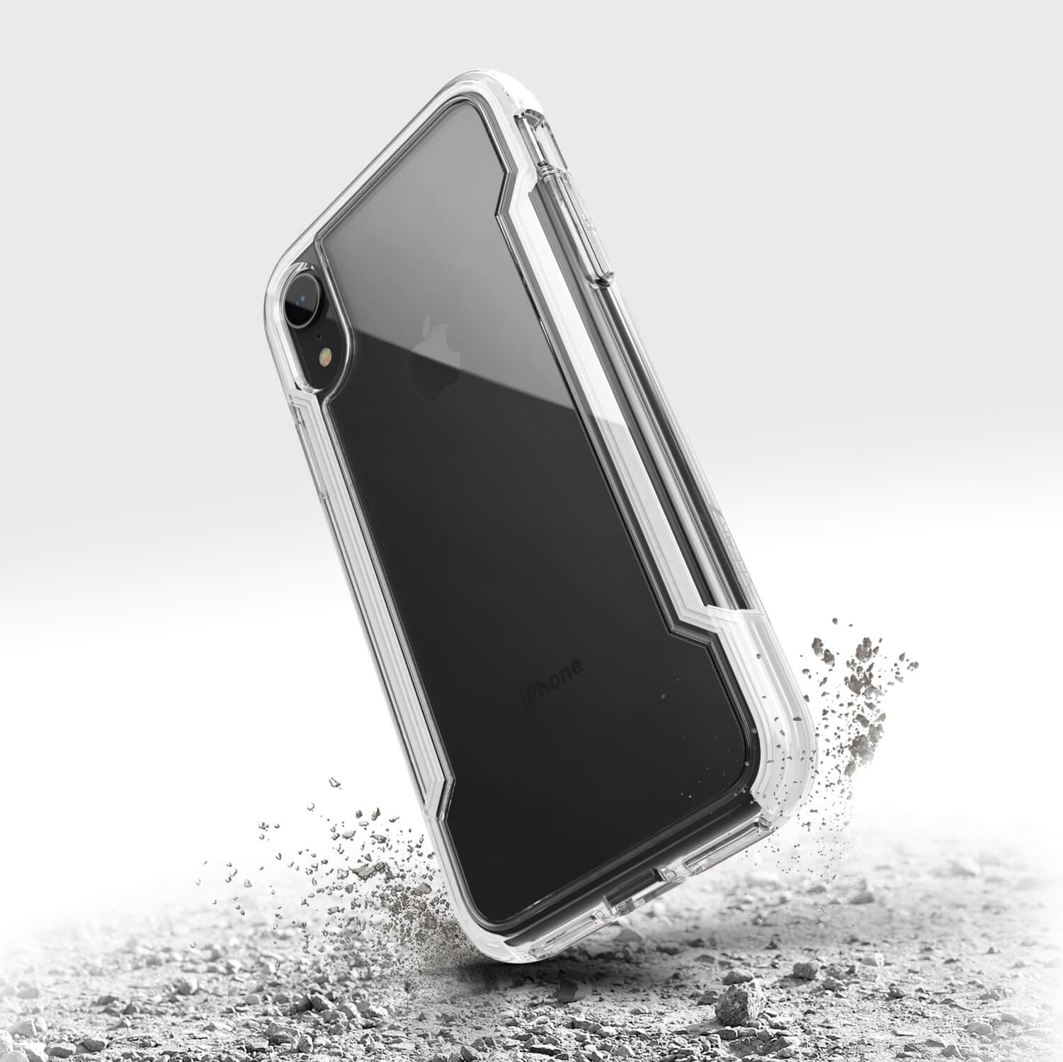 A clear Raptic iPhone XR case with a splash of sand.