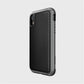 The iPhone XR Case - LUX by Raptic is a black smartphone case with an impact-resistant polycarbonate build and textured back. It includes precise camera cutouts and side buttons, set against a plain white background.