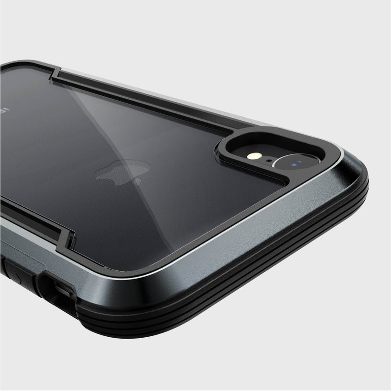 A close-up of the Raptic SHIELD iPhone XR case in black, showcasing its military-grade drop protection and dual-camera visibility, set against a light gray background.