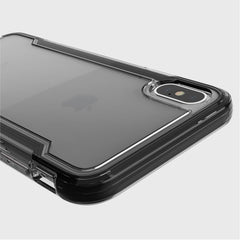 Close-up of a Raptic iPhone XS Max Case - CLEAR highlighting its transparent design with dual rear cameras against a light gray backdrop. Offering military-grade drop and anti-scratch protection, it keeps your phone pristine and secure.