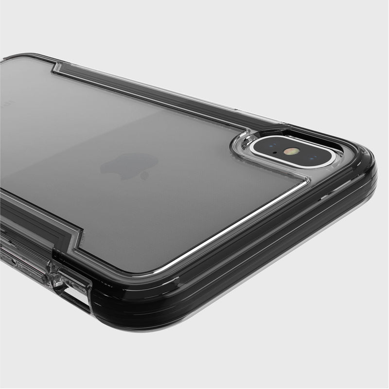 Close-up of a Raptic iPhone XS Max Case - CLEAR highlighting its transparent design with dual rear cameras against a light gray backdrop. Offering military-grade drop and anti-scratch protection, it keeps your phone pristine and secure.