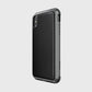 The Raptic iPhone XS Max Case - LUX features a carbon fiber textured design made from impact-resistant polycarbonate, dual cameras, and side buttons, displayed against a plain background.